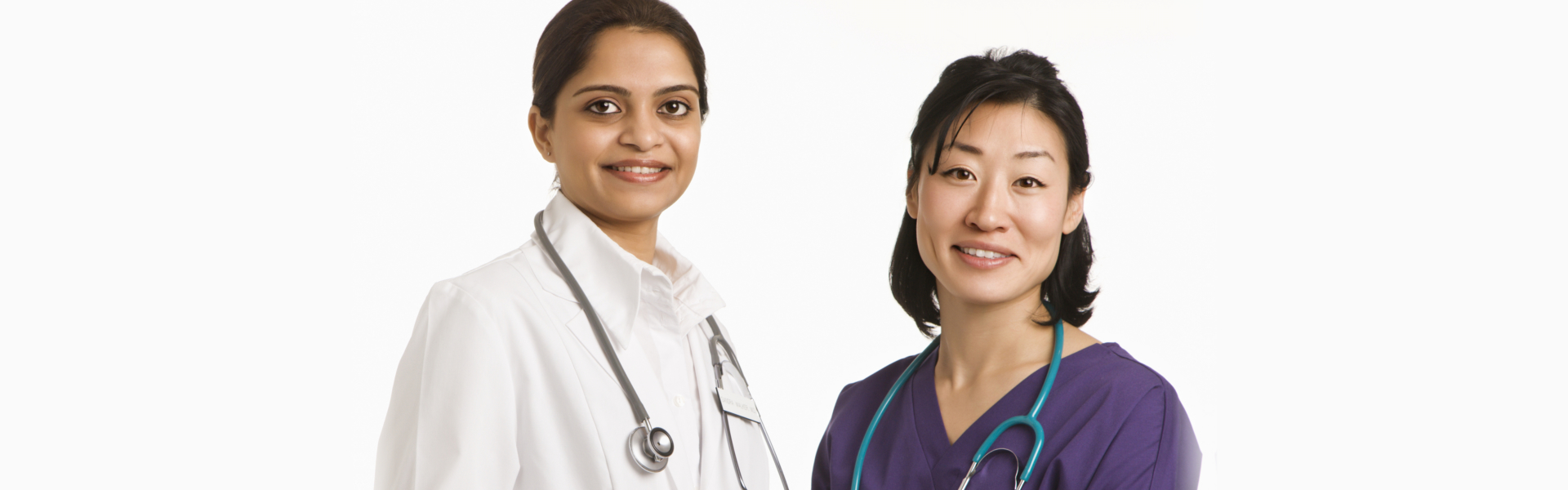 Two female doctors smiling together